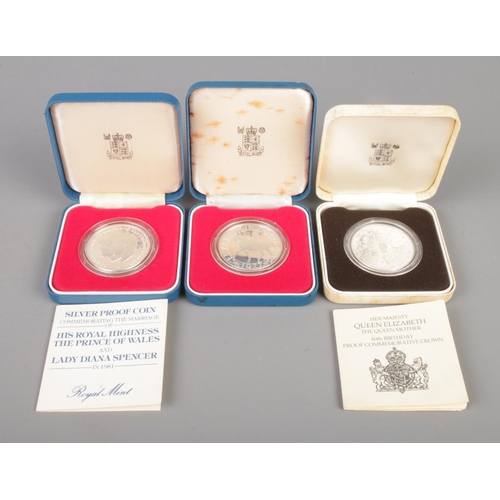 324 - Three silver proof crowns, in Royal Mint display cases. To include silver jubilee and the marriage o... 