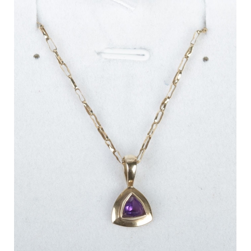 332 - A 9ct gold and amethyst pendant on 9ct gold chain. 2.43g.