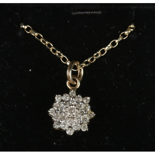 333 - A 10ct gold and diamond cluster pendant on 9ct gold chain. 4.01g. Pendant stamped 10k.