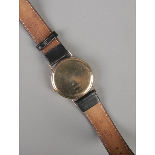 337 - A gents 9ct gold Rotary quartz wristwatch with leather strap.