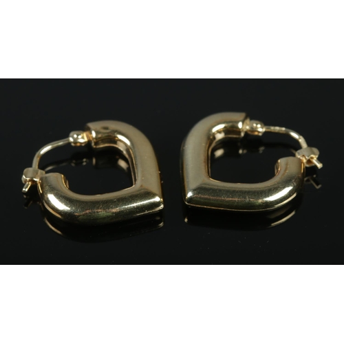 339 - A pair of 9ct gold heart shaped hoop earrings. 2.11g.