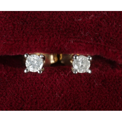 341 - A pair of 9ct gold diamond stud earrings. Diamonds approximately 0.06ct each.