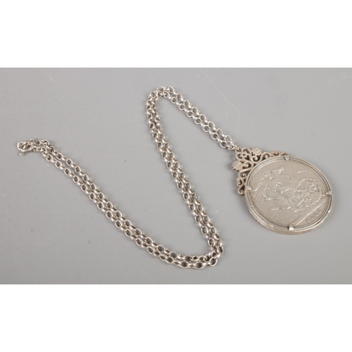 353 - A Victorian silver crown, in silver mount, on silver chain. Dated 1889, with the mount assayed for L... 