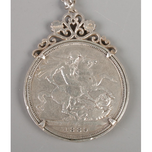 353 - A Victorian silver crown, in silver mount, on silver chain. Dated 1889, with the mount assayed for L... 