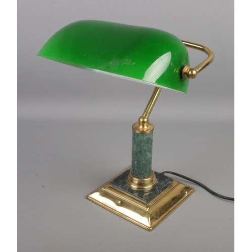 75 - A vintage brass desk lamp with green glass shade.