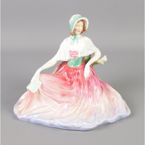 373 - A Royal Doulton Memories figure of a seated lady (HN2030). 15cm tall.