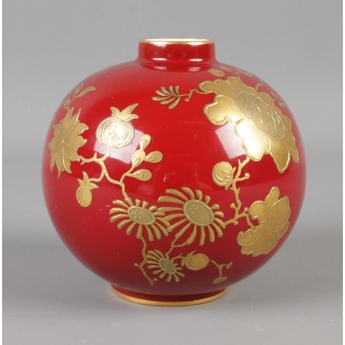 380 - A Royal Crown Derby bulbous vase for A.B Daniell and Son. Decorated with crimson glaze and gilt flor... 