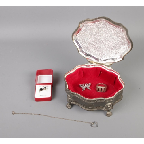 383 - A white metal jewellery box with contents of silver jewellery including signet ring, necklace, brooc... 