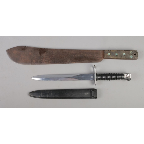 387 - A 1943 British military issue machete, with broad arrow mark and initials JJB, together with a Switz... 