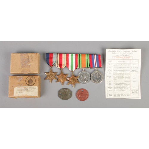 390 - A set of five medals, together with two dog tags. Presented to RAF Private Rudd. 1216837. 
1939-45 S... 