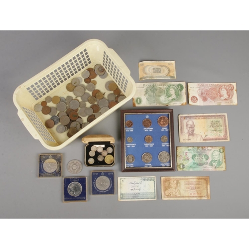 81 - A box of coins and banknotes. Includes silver Victorian examples, etc.