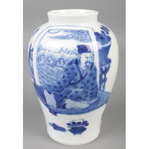 415 - A Chinese blue & white vase decorated with figures. Spurious Kangxi marks to the base. (12cm)