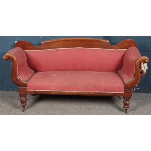 423 - A Victorian mahogany upholstered parlour sofa. (92cm x 185cm x 59cm)