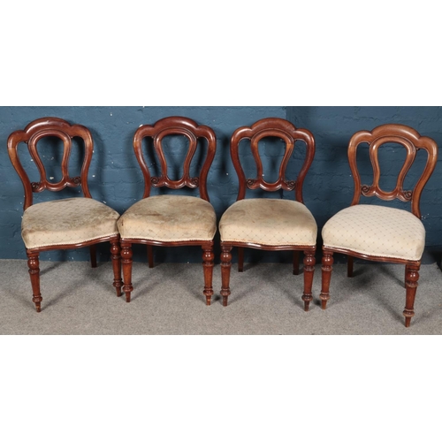 428 - A set of four Victorian carved mahogany dining chairs with upholstered seat.