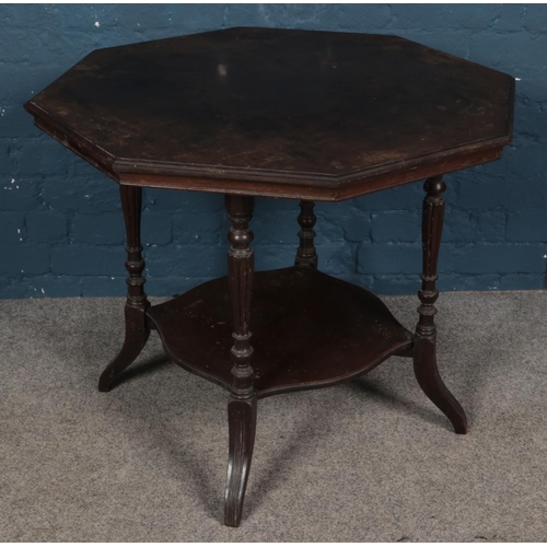 433 - A large Victorian mahogany octagonal window table. Diameter (85cm)