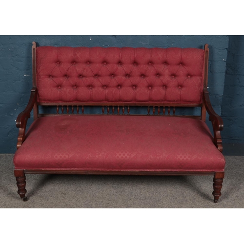 435 - A Victorian mahogany parlour sofa with deep button upholstered back. Height 88cm, Width 125cm, Depth... 