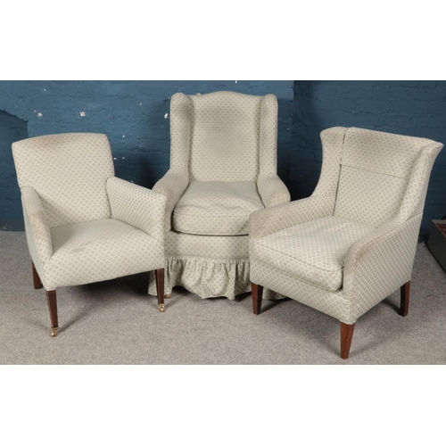 436 - Three arm chairs with matching upholstery. Includes two wing back examples.