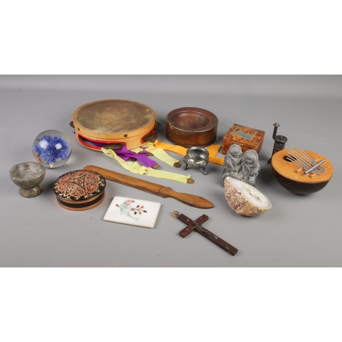 93 - A quantity of collectables. Includes bronze ashtray, musical instruments, Jerusalem wooden page turn... 