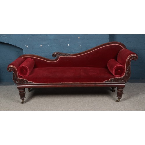 439 - A Victorian carved mahogany chaise lounge. Height 93cm, Length 203cm, Depth 63cm.