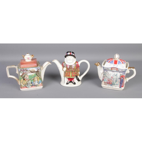 50 - Three James Sadler novelty teapots including Alice in Wonderland, Piccadilly and Yeoman Warder.