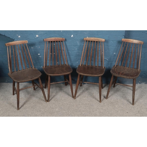 338 - A set of four Ercol style stained ash/elm dining chairs.