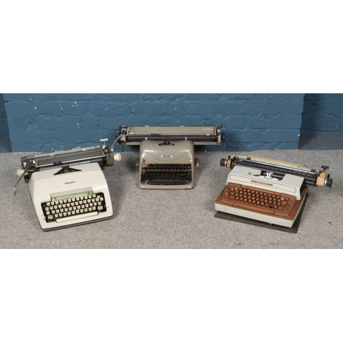 209 - Three typewriters; Olivetti Lexikon 80, Smith-Corona Coronamatic 8000 and Olympia examples.