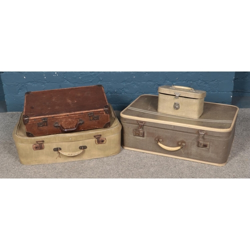 218 - Three assorted vintage travel cases along with a vanity case.