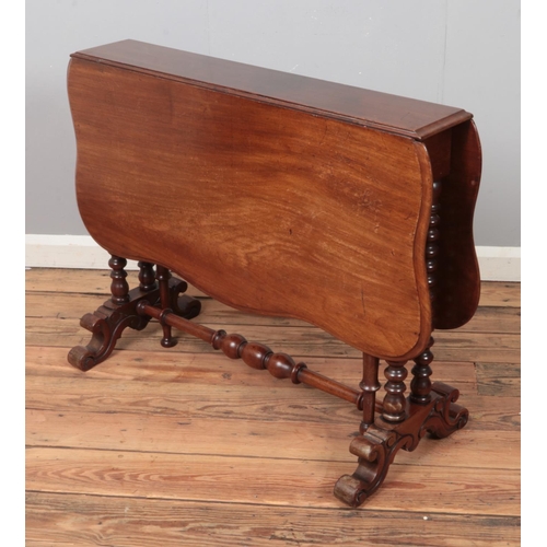 353 - A mahogany Sutherland drop-leaf table raised on bobbin turned supports. Approx. dimensions 108cm x 9... 