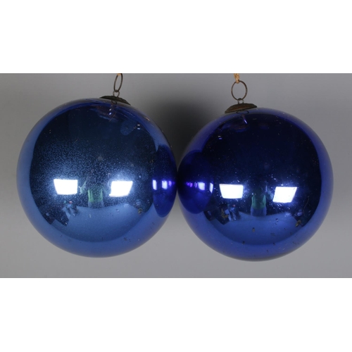 106 - Two Marque Deposee blue glass bauble. (12cm x 12cm) Excluding hanger.