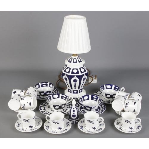 111 - A collection of mostly unfinished Imari pattern ceramics. Includes table lamp, cups & saucers, bowls... 