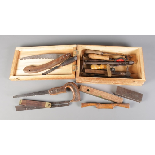 124 - A tool box with contents of vintage tools. To include Rabone Chesterman spirit level, Stead & Co (Sh... 