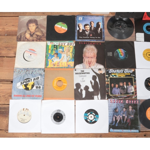 155 - A large box of assorted singles records, mainly from the 1960's and 1970's. To include Elvis, Elton ... 