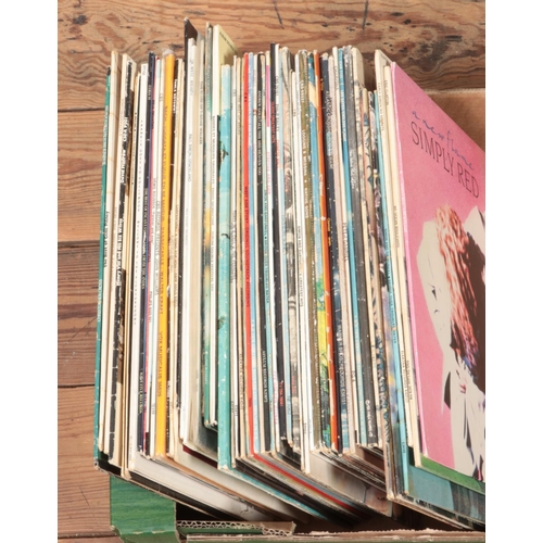 170 - A collection of assorted vinyl records of mainly pop and rock to include Phil Collins, Elton John, E... 