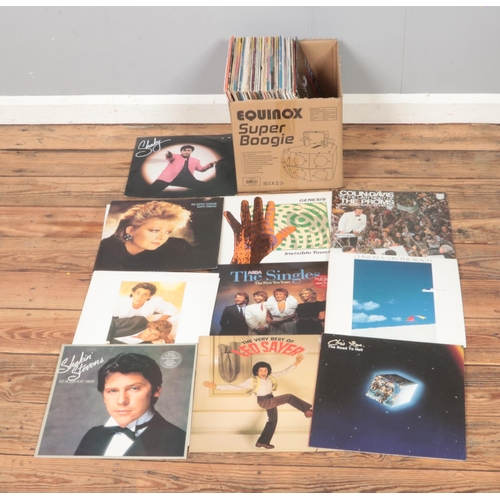 172 - A collection of assorted vinyl records of mainly pop and easy listening. Examples include Genesis, C... 