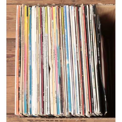 172 - A collection of assorted vinyl records of mainly pop and easy listening. Examples include Genesis, C... 