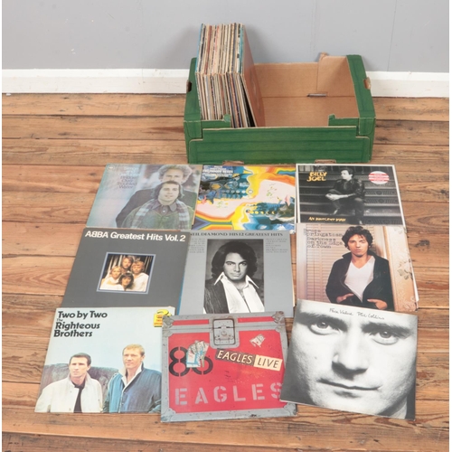 173 - A collection of assorted vinyl records of mainly pop and rock to include The Who, Abba, Bruce Spring... 