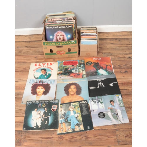 181 - One box of assorted vinyl records and one box of singles, mainly of pop and rock. Examples include M... 