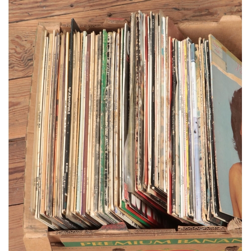 181 - One box of assorted vinyl records and one box of singles, mainly of pop and rock. Examples include M... 