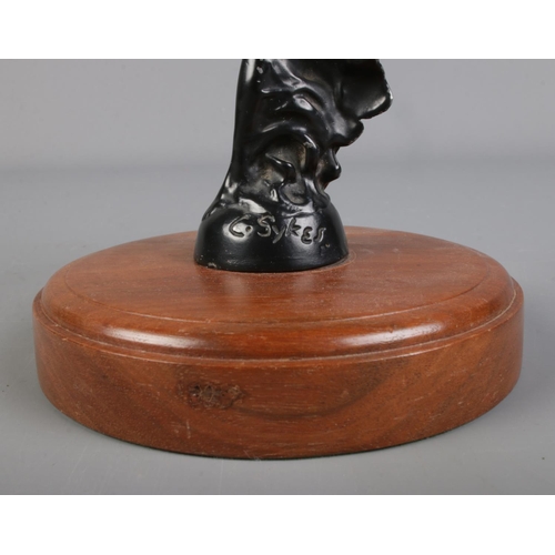 32 - A Rolls Royce Spirit of Ecstasy car mascot signed C. Sykes to base and mounted on walnut base.