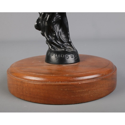 32 - A Rolls Royce Spirit of Ecstasy car mascot signed C. Sykes to base and mounted on walnut base.