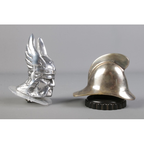 35 - A Rover Viking car mascot along with similar mascot in the form of a fireman's helmet.