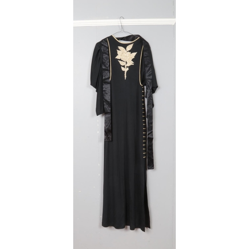 207 - A John Bates for Jean Varon vintage black dress featuring full length dolman sleeves and gold embroi... 