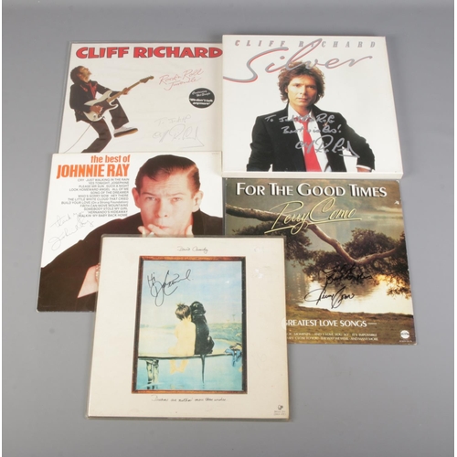 48 - A collection of five signed vinyl records to include two from Cliff Richard, Perry Como, David Cassi... 