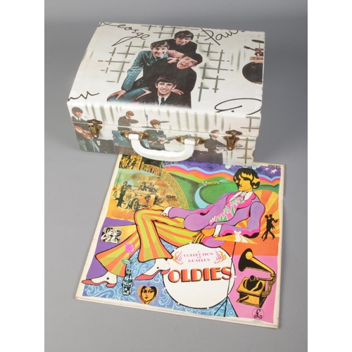 61 - The Beatles Westminster portable record player along with A Collection of Beatles Oldies vinyl recor... 