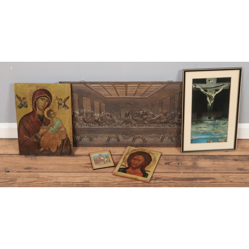 227 - A quantity of religious plaques. Includes cast iron last supper example, etc.