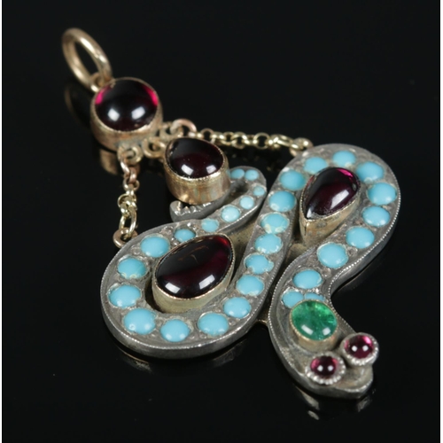 A high carat gold snake pendant set with turquoise and garnets. 7.14g gross.