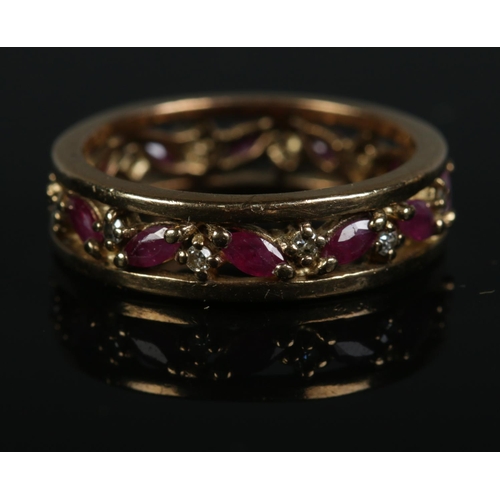 256 - A 9ct gold ruby and diamond eternity ring. Size Q, 4.5g.