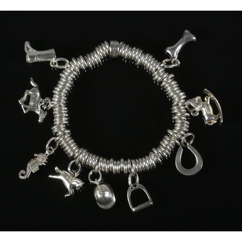 257 - A Links of London silver ring charm bracelet with 9 silver charms including horseshoe, jockey on hor... 