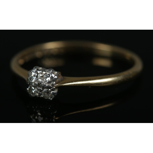 258 - An 18ct gold five stone diamond cluster ring. Size P, 1.8g.