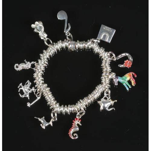 259 - A Links of London silver ring charm bracelet with 10 silver charms including zebra, teapot, seahorse... 